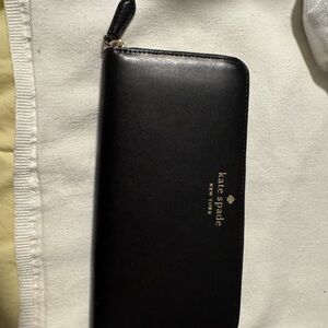 kate spade Black Zip-Around Leather Wallet with Gold Logo